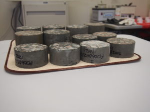 ASTM C1202 specimens ready to epoxy and insert in test cells.