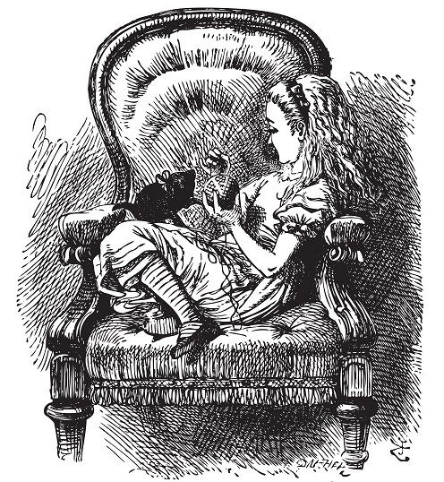 Alice sitting in chair with kitten from Alice in Wonderland