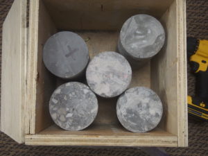 concrete cores in a crate without packing material