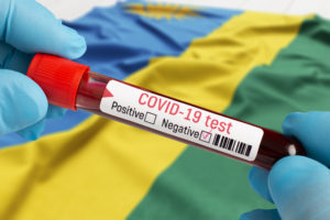 COVID-19 test vial with Rwandan flag