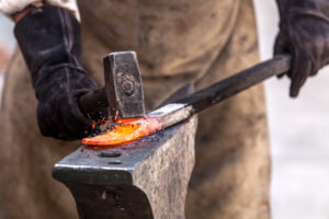 smith forging a sword