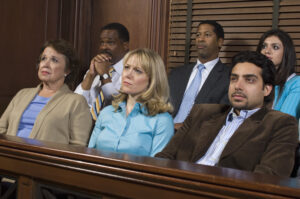 Jurors listening to witness testimony