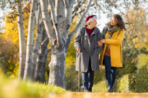 older and younger women walking outdoors