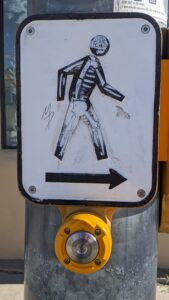 A walk sign in Santa Fe, NM, has a distinct Dia de los Muertos vibe.